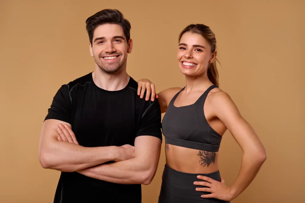 an energetic fitness duo is posing confidently aga utc ()